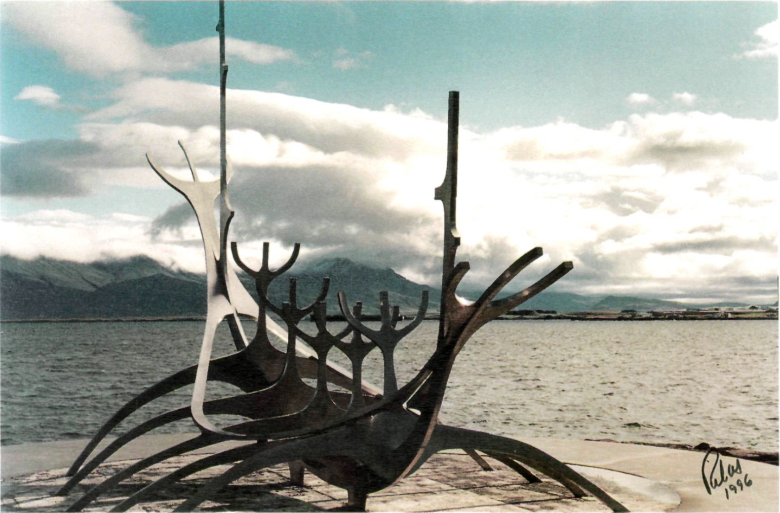 Sculpture resembling a Viking ship on a shoreline