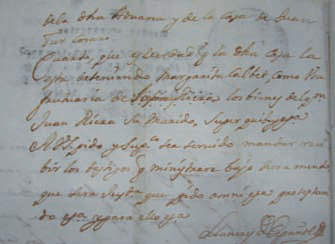 A dalt, fragment del document de la Cúria de l'any 1741 en el qual surt el nom de Joan Tur unit al sobrenom «Cossari».