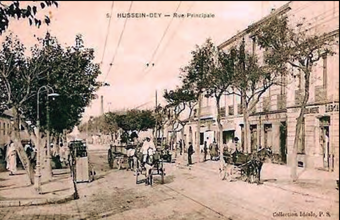 Carrer principal de Hussein Dey, poble industrial i obrer, a la primeria del segle xx, on hi havia un temple protestant on assistien sobretot valencians, menorquins i eivissencs.